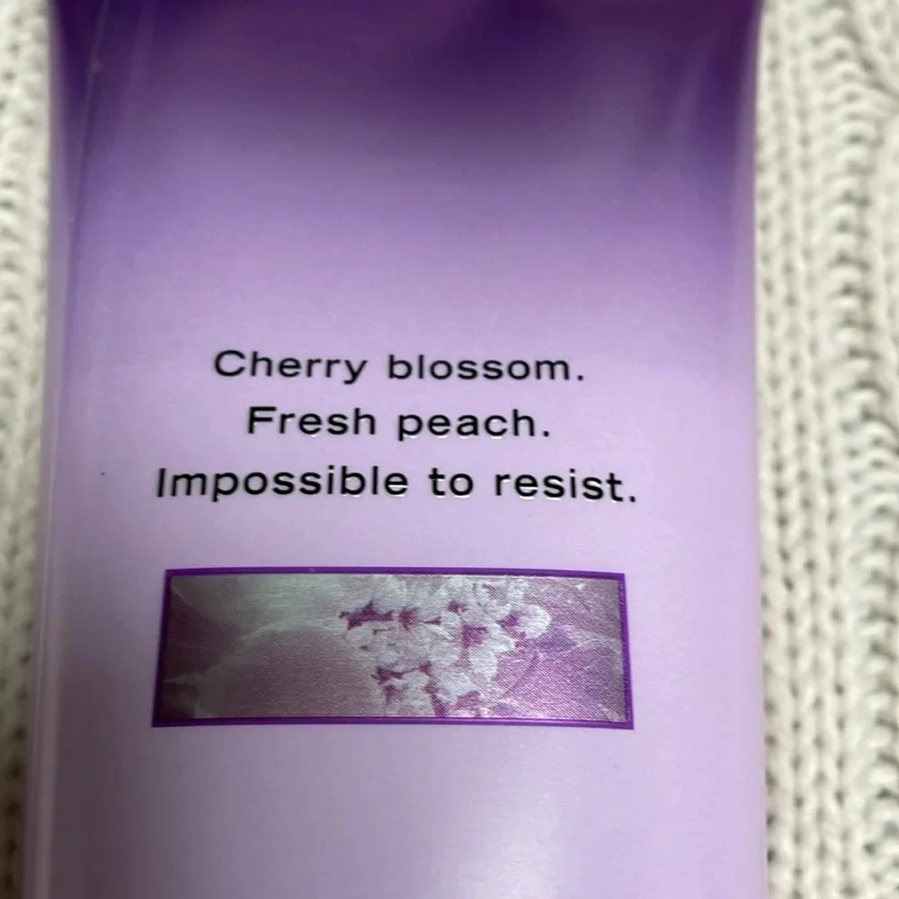 NWOT Victoria Secret Love Spell Body Lotion. 8oz. Purple tube cherry/peach smell
